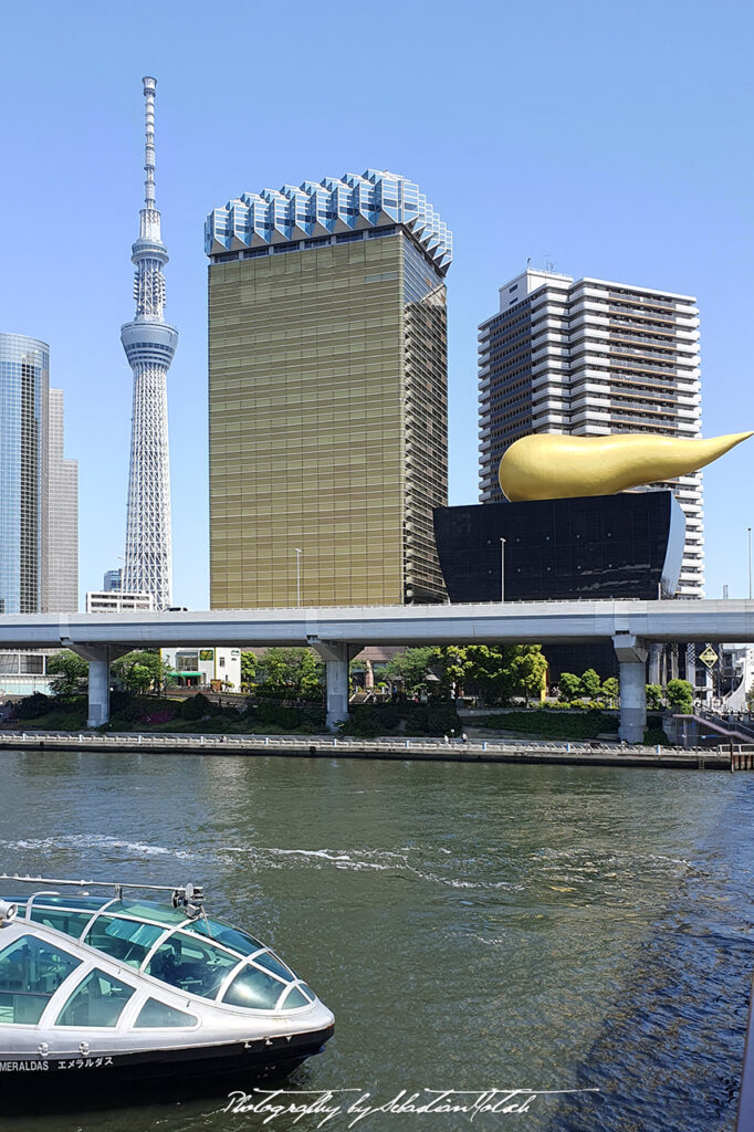 Asahi Building and Emeraldas Ship Tokyo Japan Photo by Sebastian Motsch